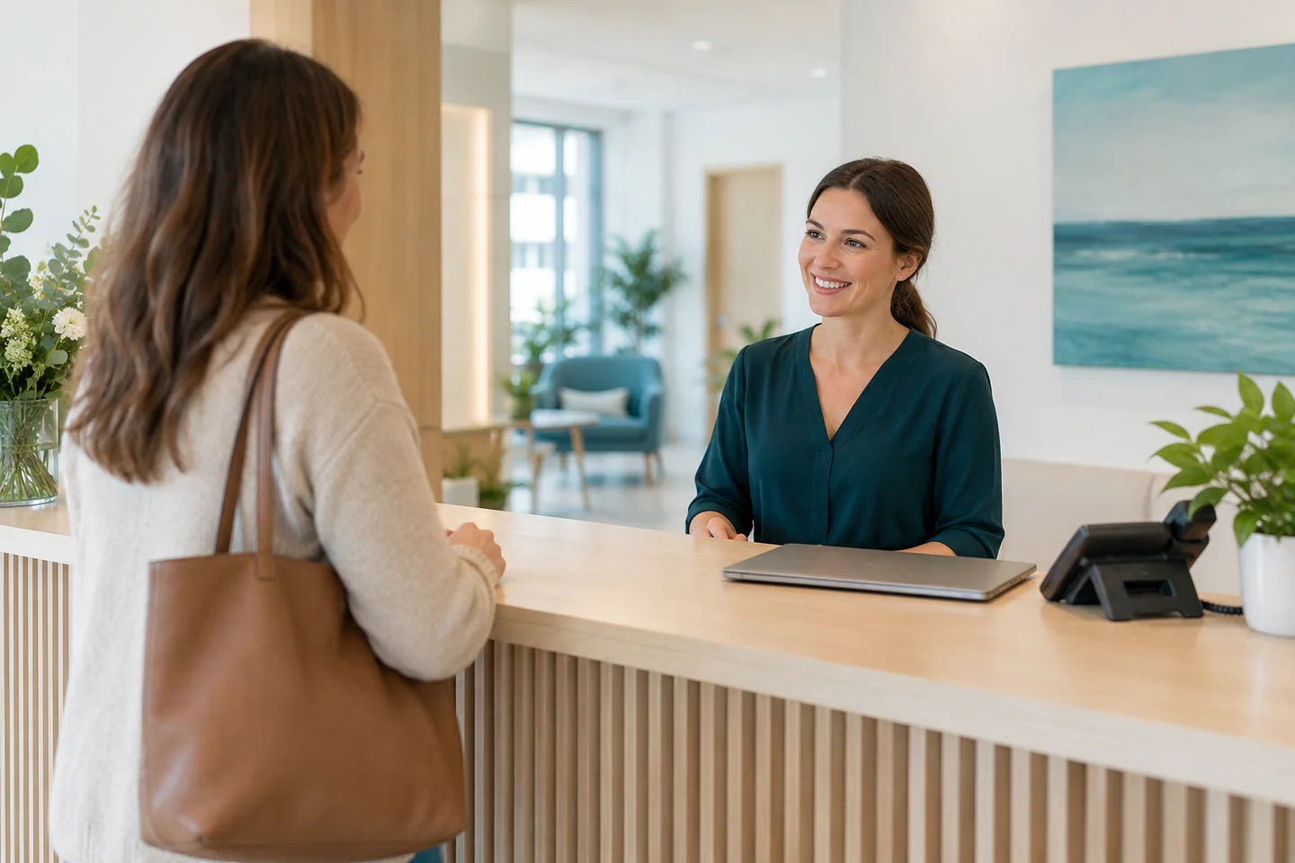 A visitor being welcomed and assisted at reception
